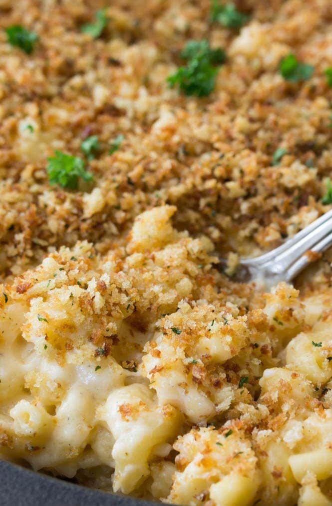 A spoonful of panko-topped mac and cheese in the pan