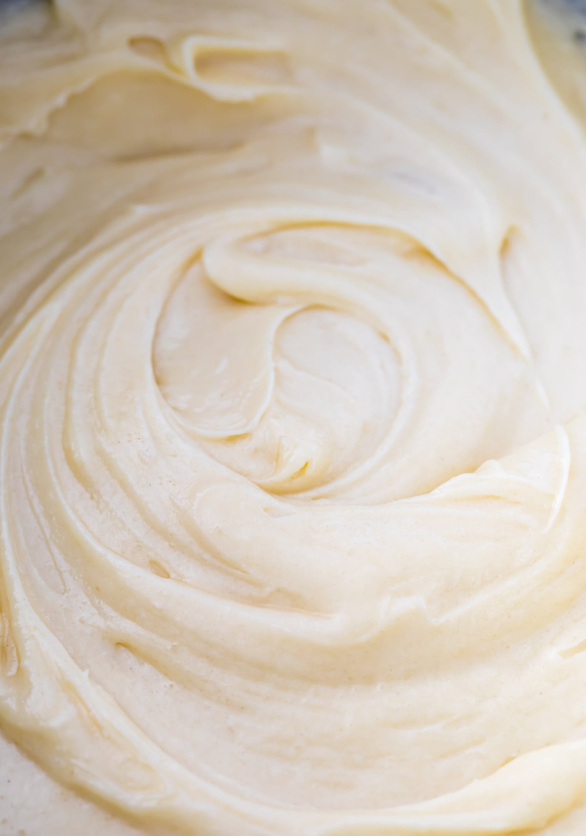 close-up of thick, velvety cream-colored pound cake batter