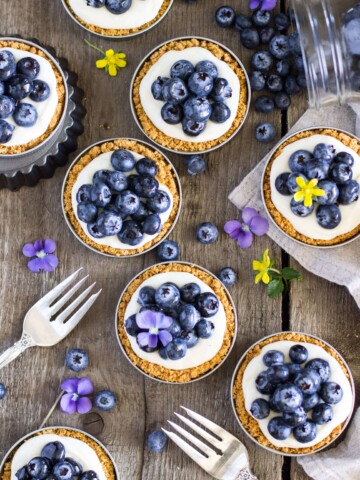 Overhead of blueberry lemon tarts
