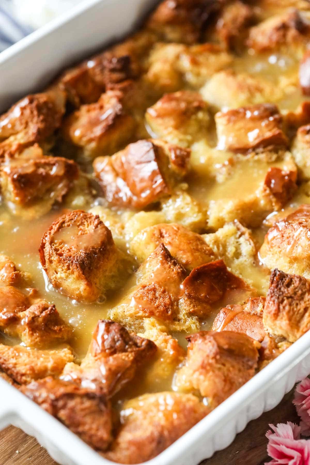 Bread custard pudding that's been drizzled with a caramel sauce.