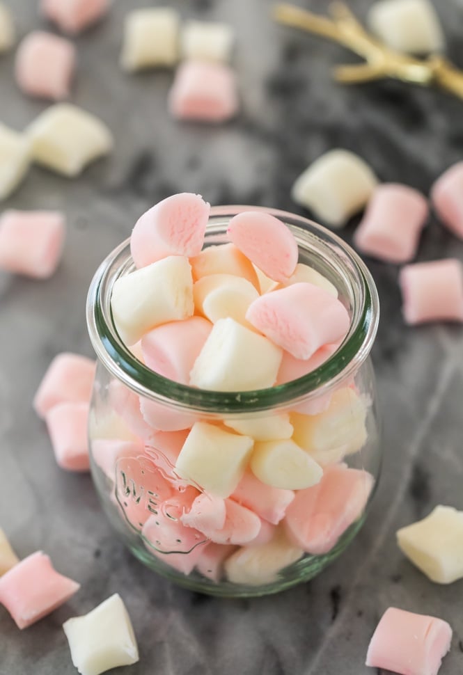 Pink and white butter mints in a glass jar