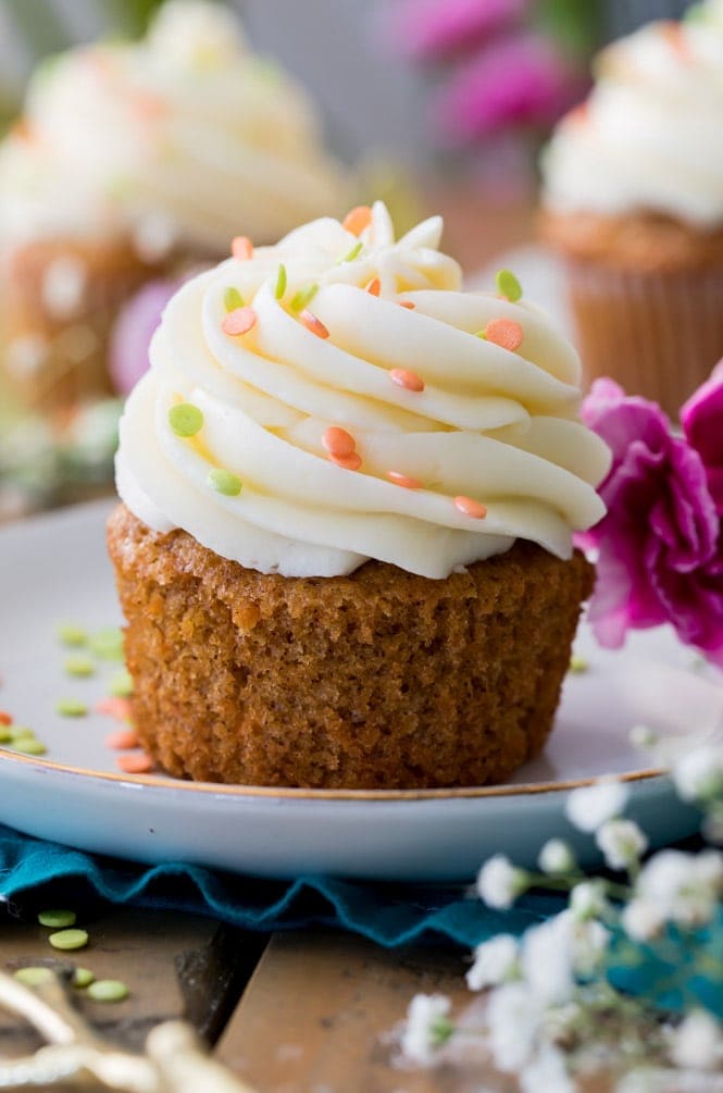 A Carrot Cake Cupcake Topped off with a cream cheese frosting swirl