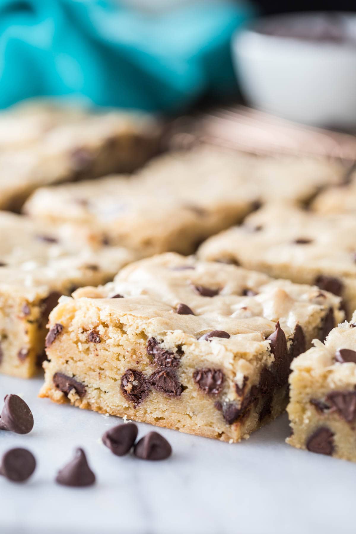 close-up view of sliced chocolate chip cookie bars neatly arranged in rows