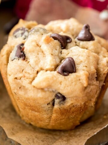 peanut butter muffin with chocolate chips on parchment paper