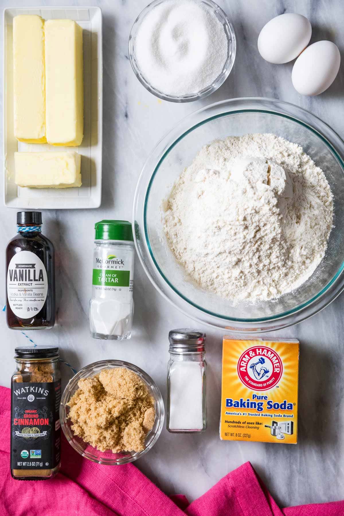 Overhead view of ingredients including butter, brown sugar, cinnamon, and more.