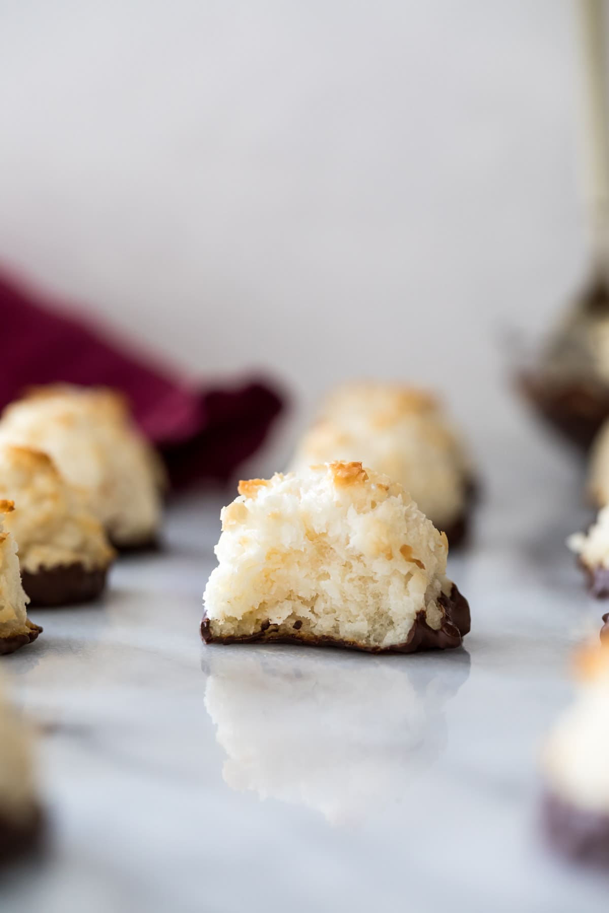 chocolate dipped coconut macaroon missing one bite