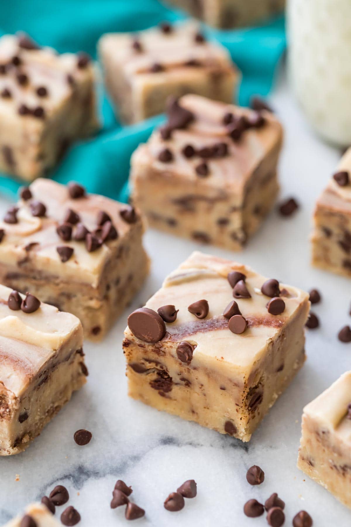 overhead view of cookie dough fudge squares decorated with mini chocolate chips