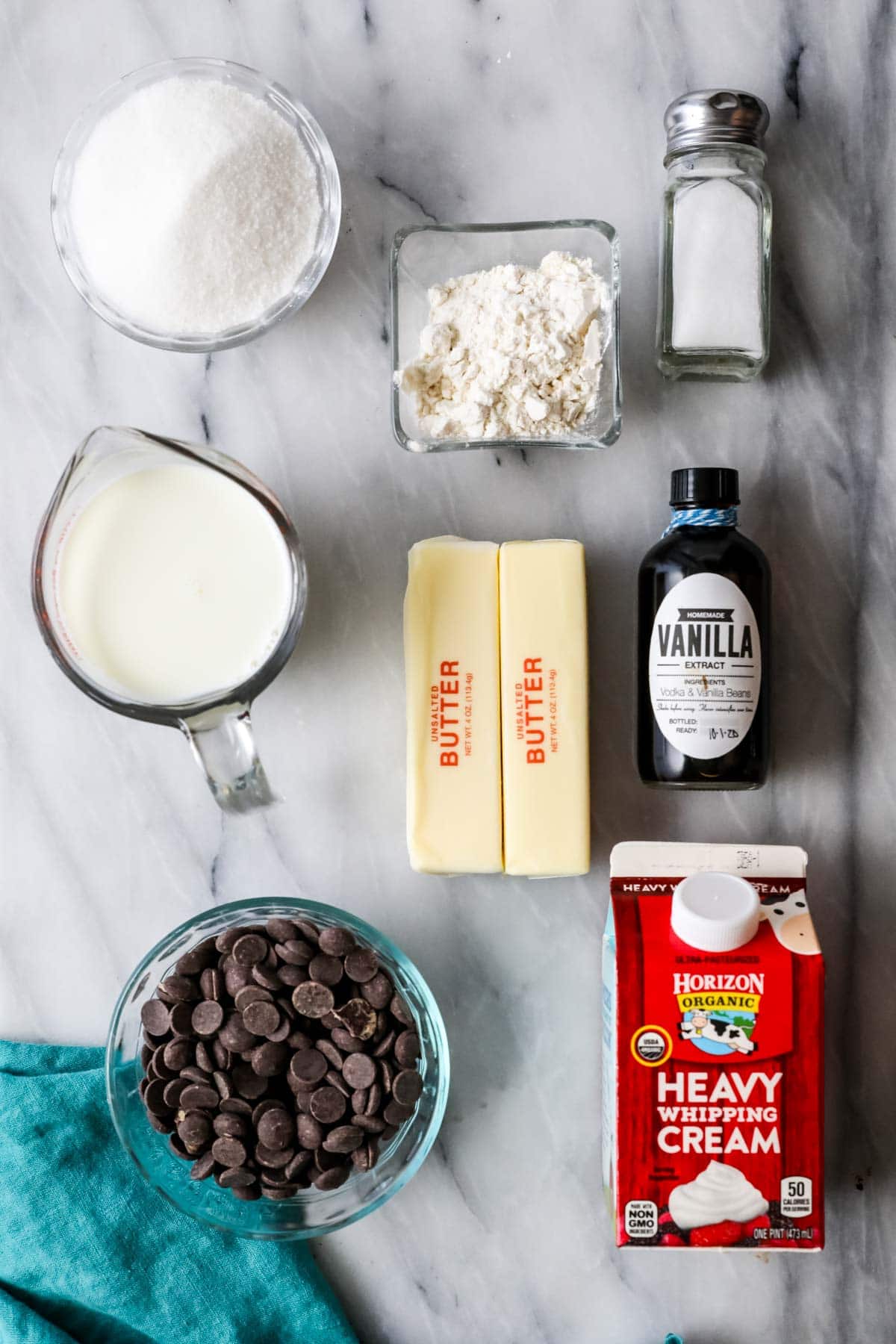 Overhead view of ingredients including butter, heavy cream, chocolate, and more.