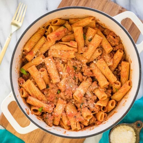 overhead view of a dutch oven filled with rigatoni