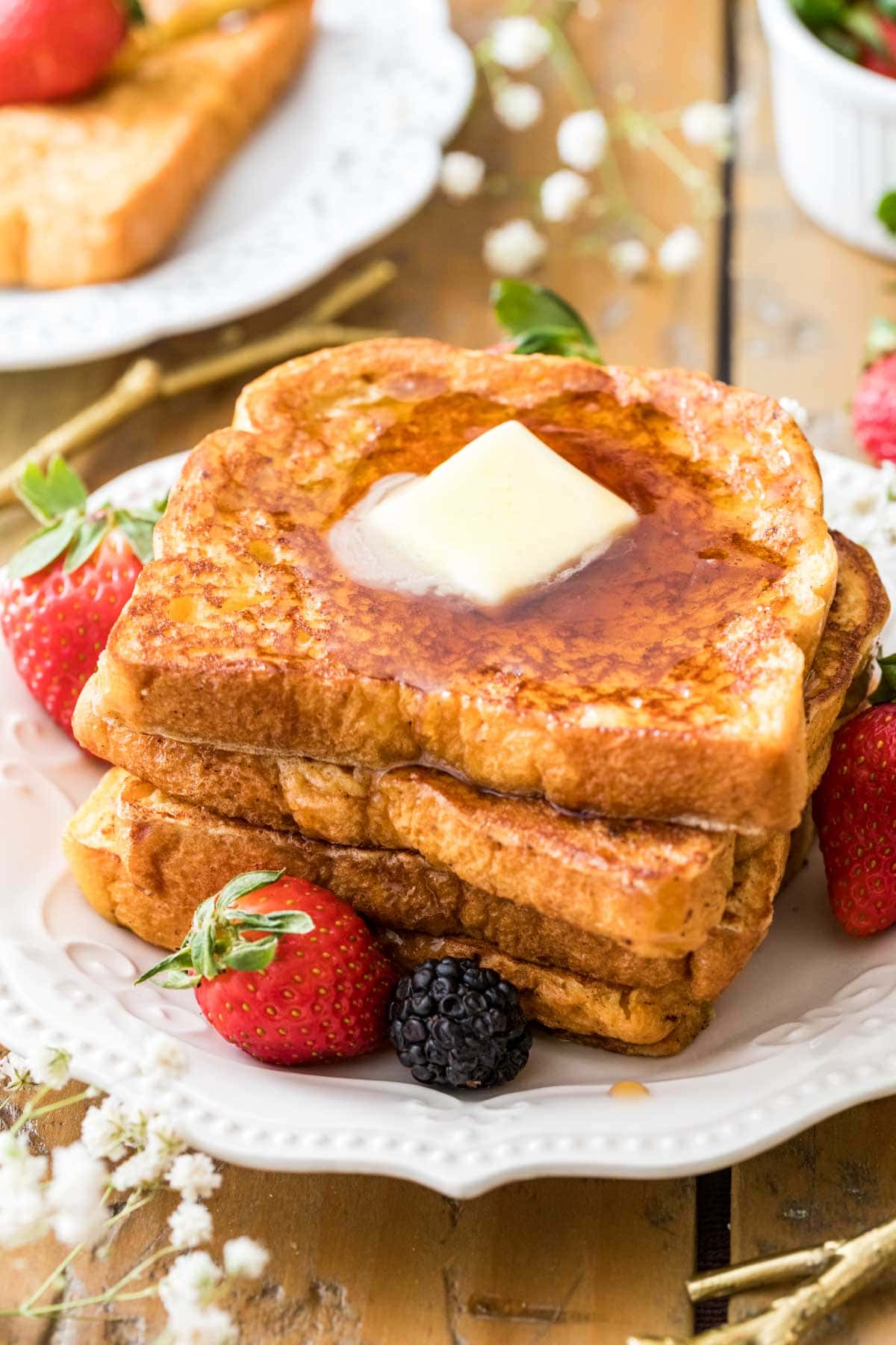 Pat of butter melting into a stack of french toast.