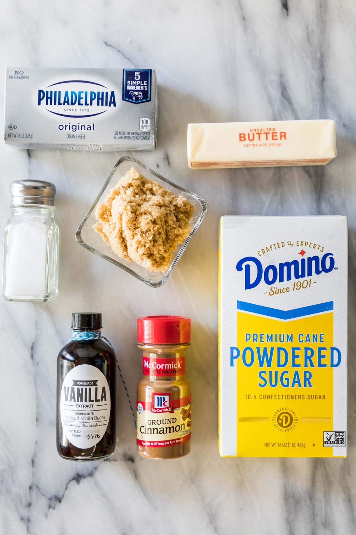 Overhead view of ingredients including cream cheese, brown sugar, cinnamon, and more.