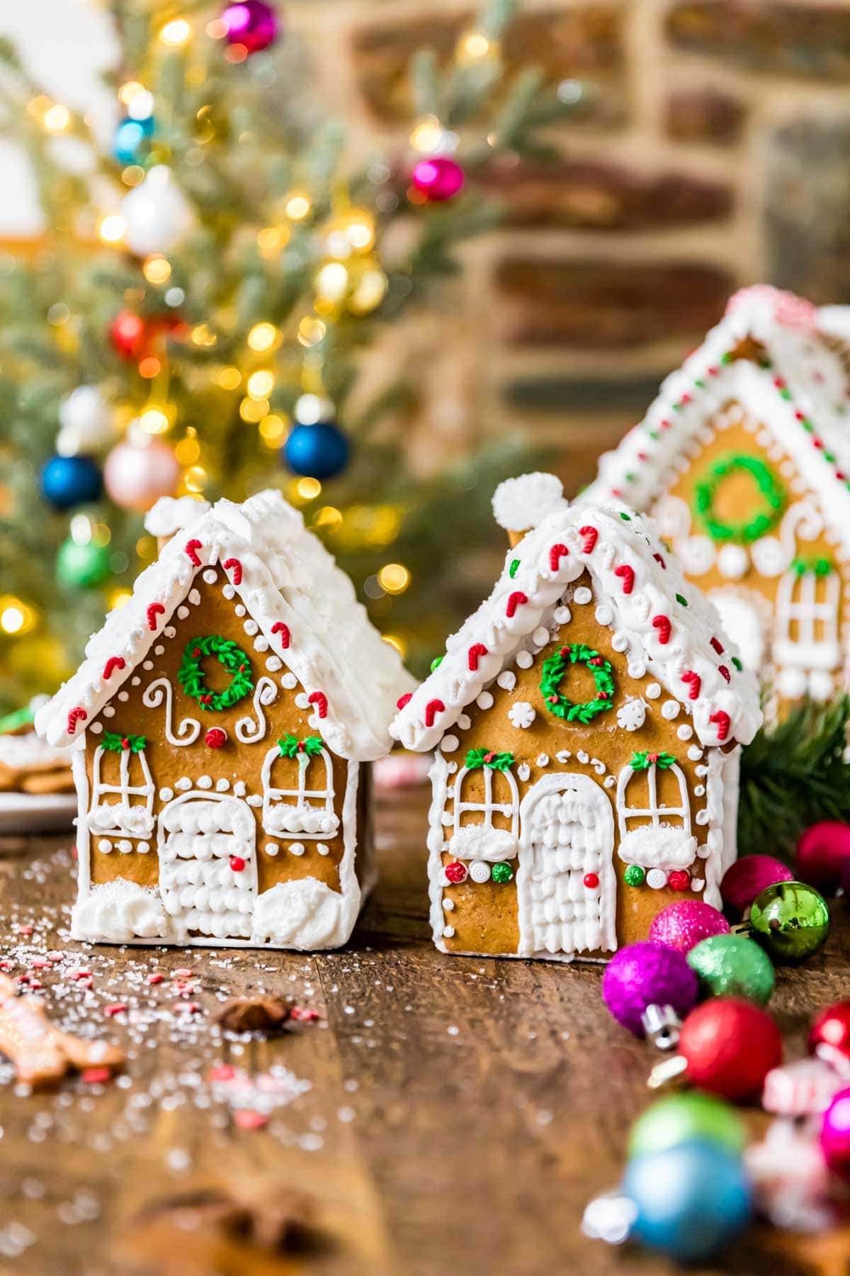 Two small gingerbread cottages decorated with royal icing.