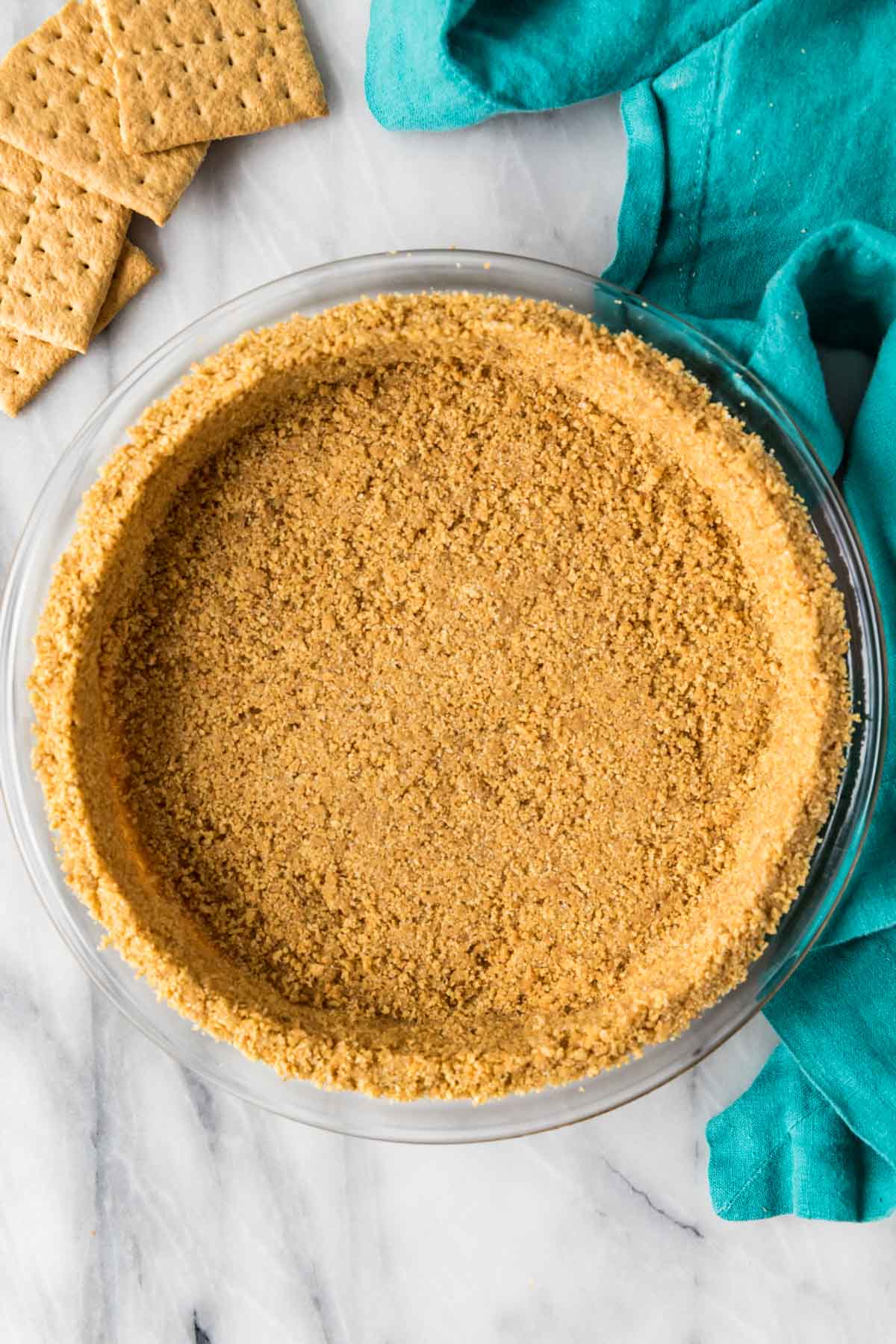 Overhead view of a smooth crust made from a homemade graham cracker crust recipe.