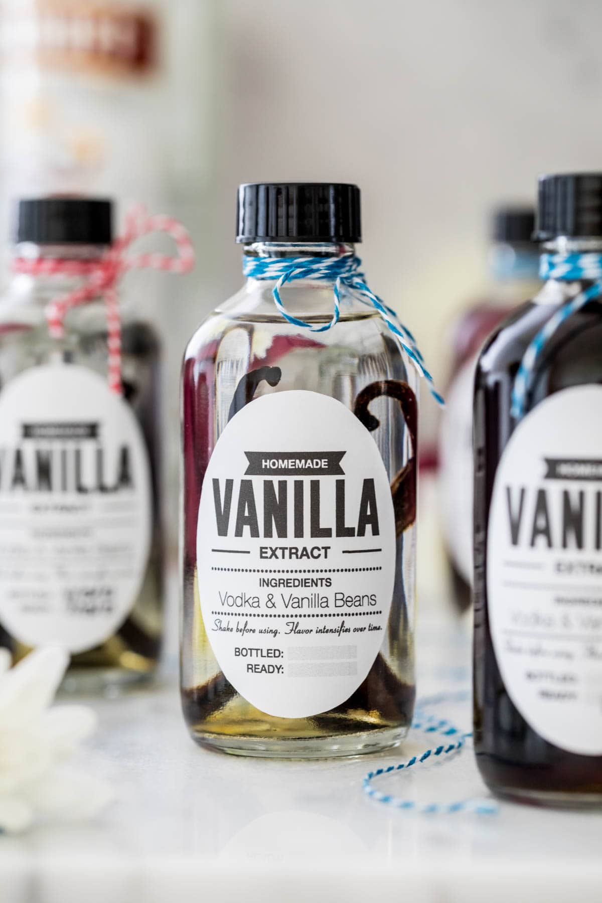 Bottle of extract showing vanilla beans
