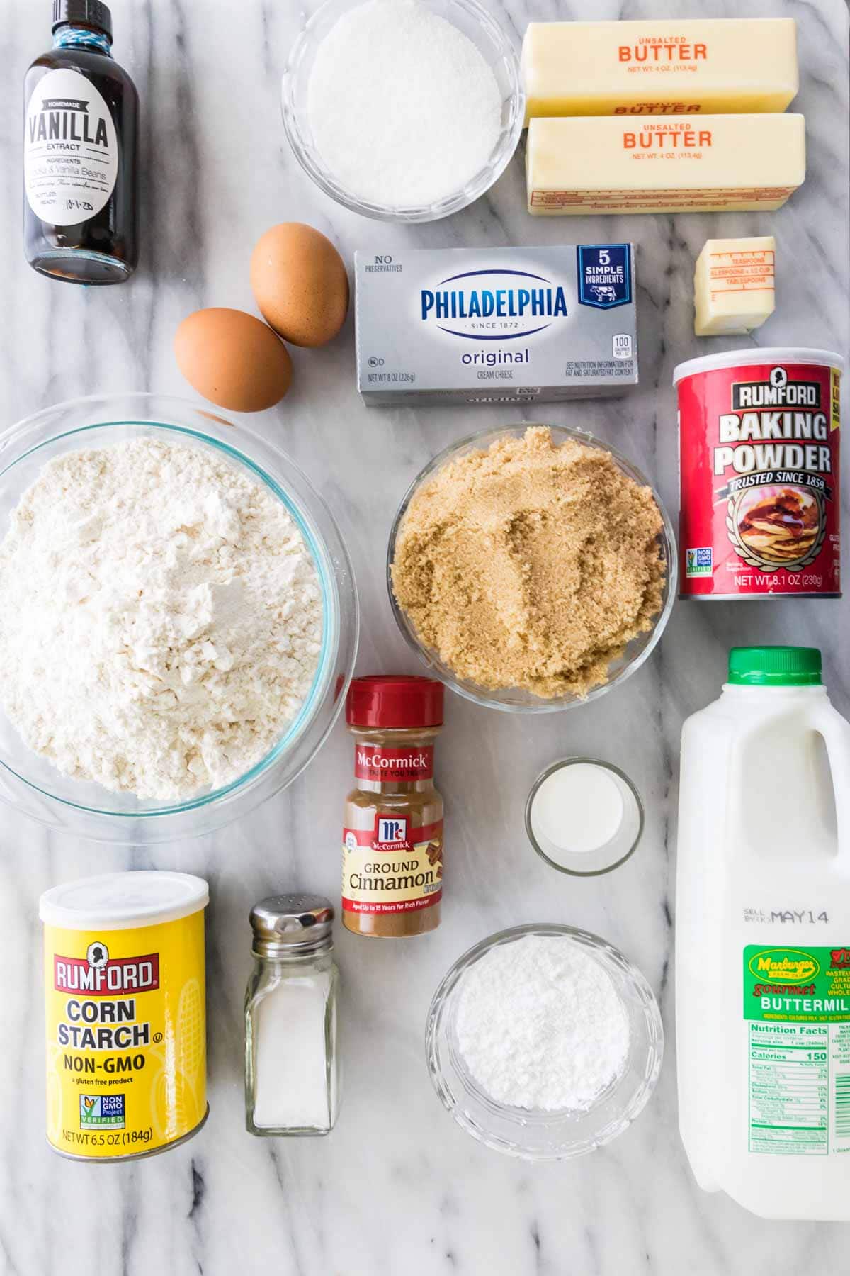 overhead view of ingredients including flour, sugar, buttermilk, cinnamon, and more