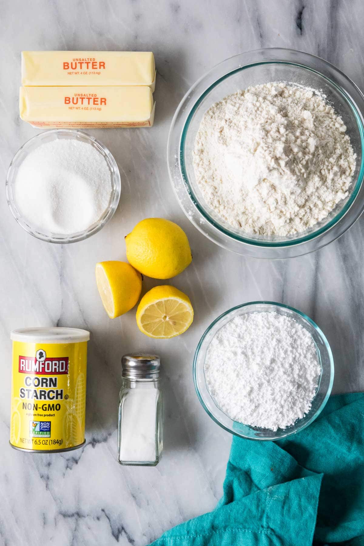 Overhead view of ingredients including lemons, flour, cornstarch, and more.