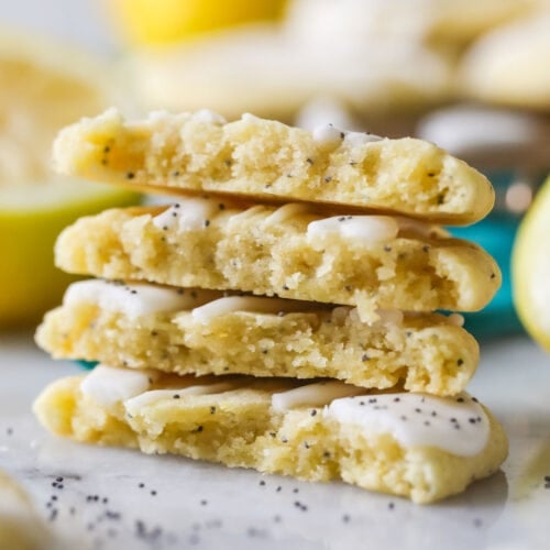 Four halves of a lemon poppy seed cookies stacked on top of each other.