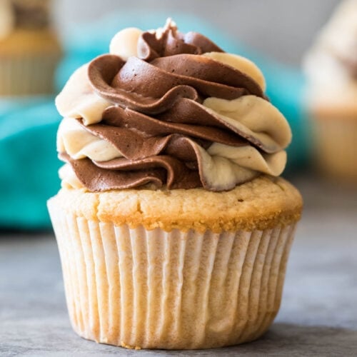 Peanut butter cupcake topped with a swirled chocolate peanut butter frosting.