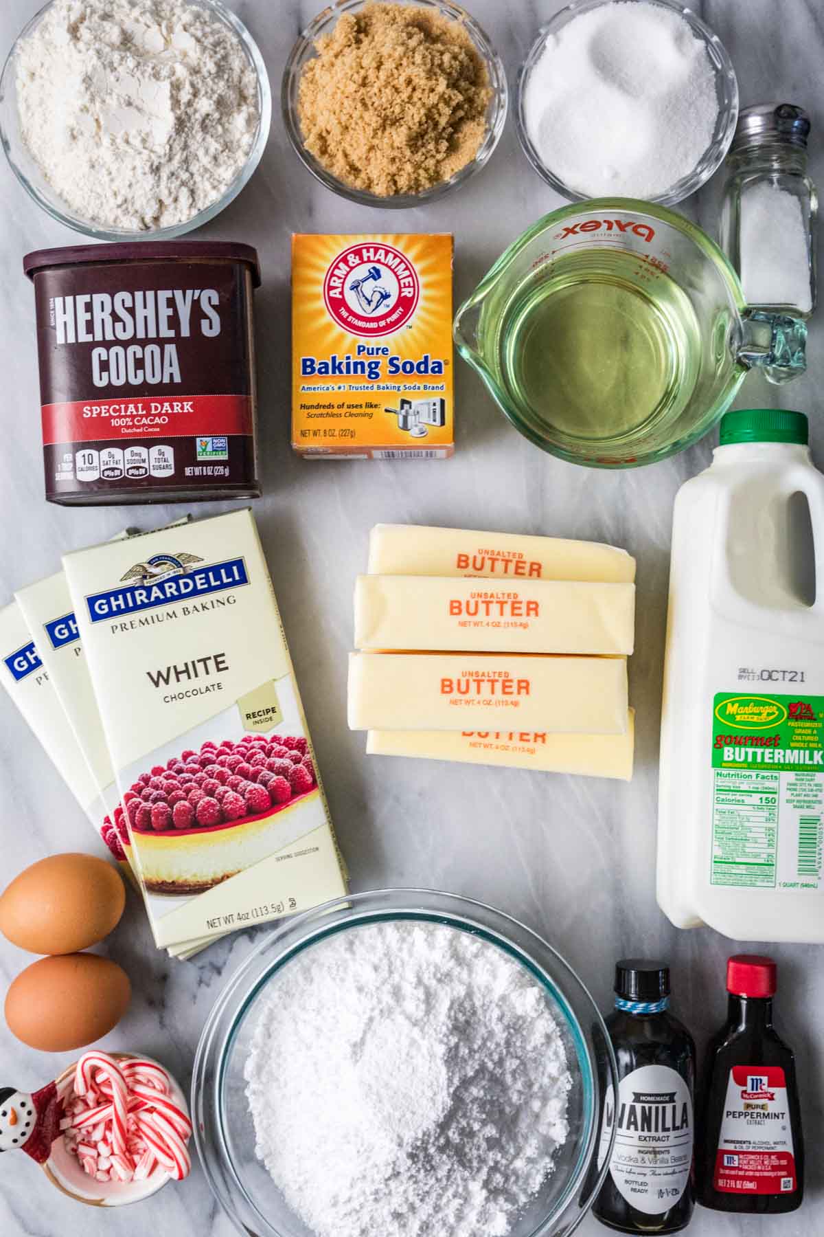 Overhead view of ingredients including buttermilk, white chocolate, peppermint extract, and more.