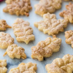 leaf shaped pie crust cookies dusted with cinnamon sugar