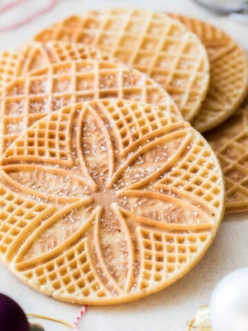 Pizzelle arranged on white board