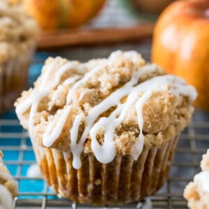 pumpkin muffin topped with streusel and vanilla glaze