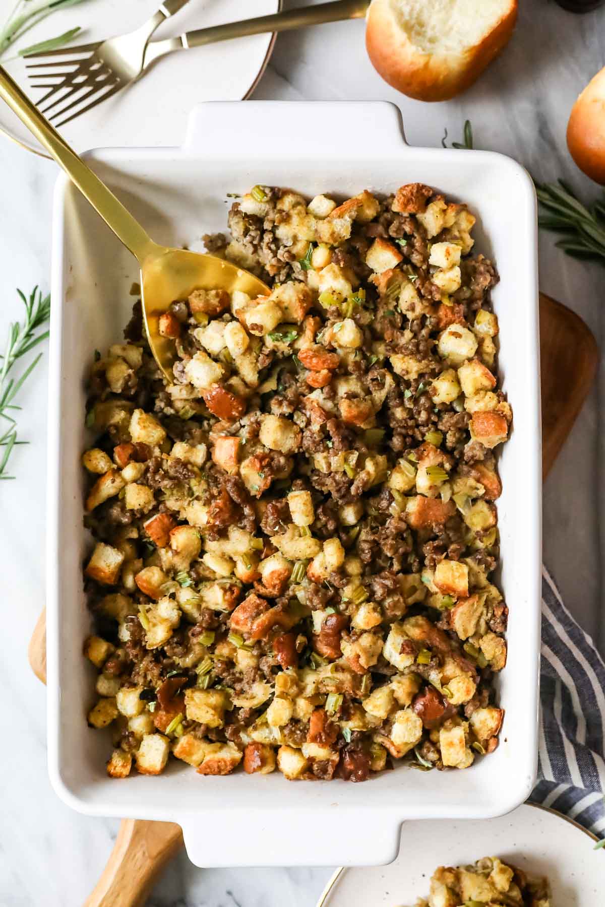 Overhead view of sausage stuffing in a casserole dish.