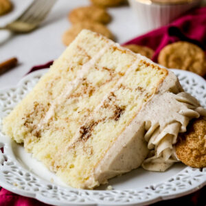 Slice of snickerdoodle cake on a white plate.