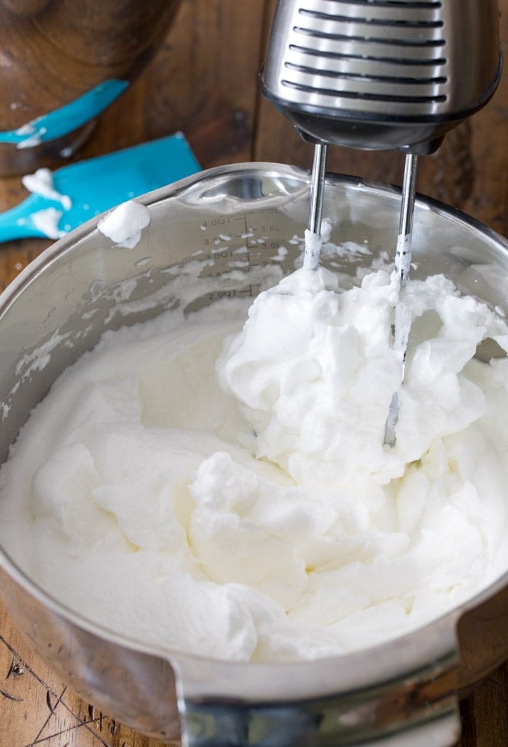 Whipping egg whites to stiff peaks for white cake